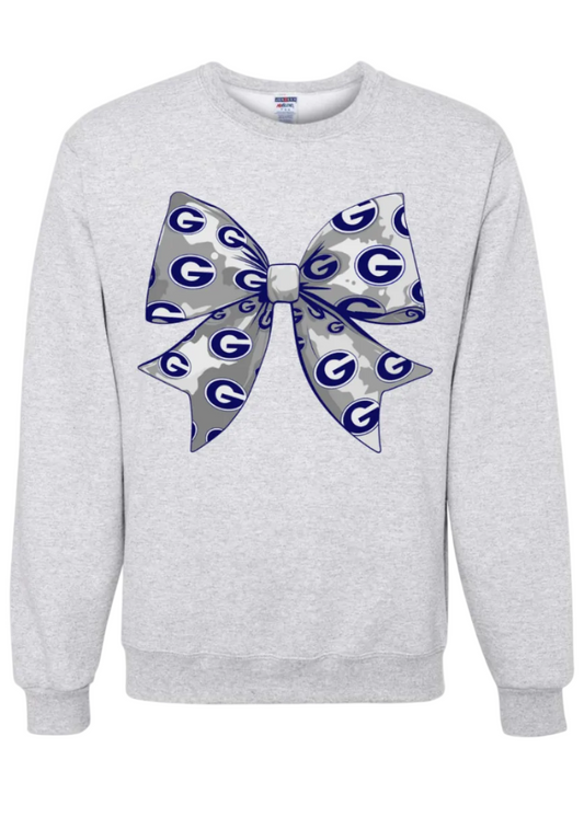 Ash crewneck sweatshirt with bow covered in the Greenwood G pendant.